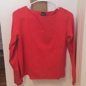 Bright orange sweater